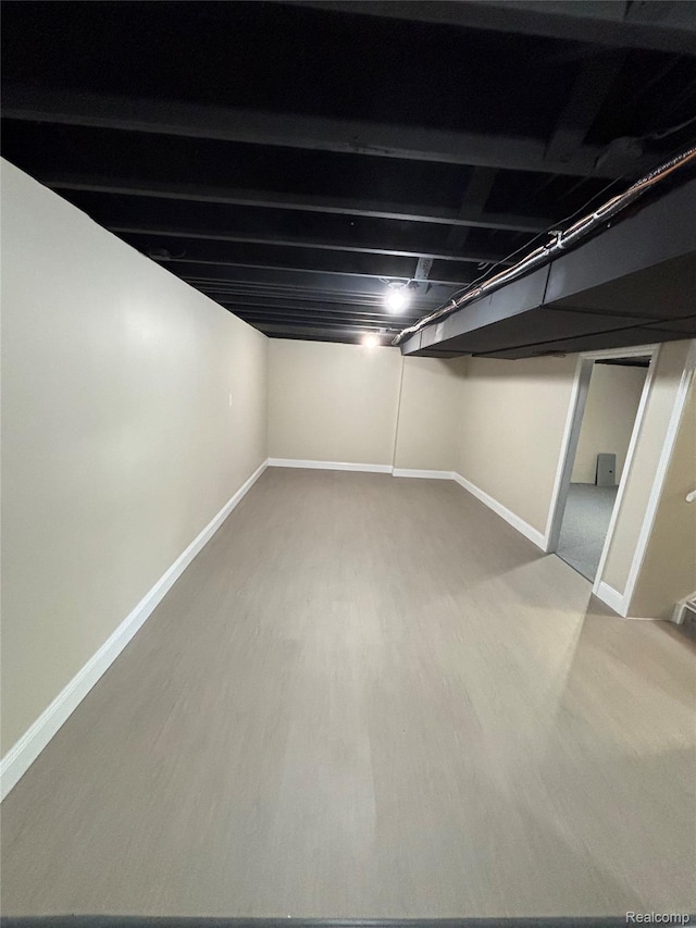 1139 S 7th St, Ann Arbor, MI 48103 - finished below grade area with baseboards and wood finished floors