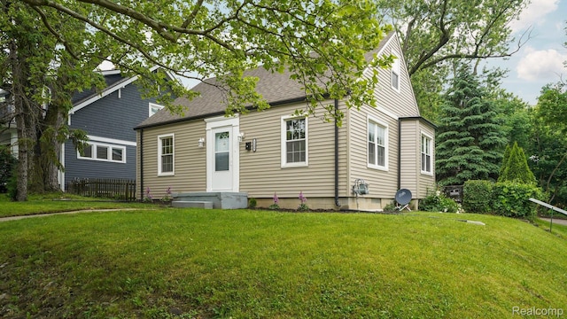 1139 S 7th St, Ann Arbor, MI 48103 - view of front of home with a front lawn and a shingled roof