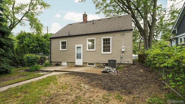 1139 S 7th St, Ann Arbor, MI 48103 - rear view of property with a chimney, a patio area, and a shingled roof