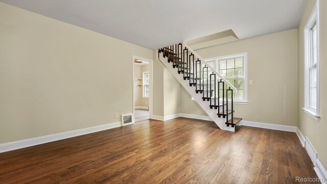 1139 S 7th St, Ann Arbor, MI 48103 - spare room with stairs and dark wood finished floors