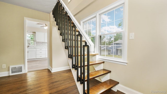 1139 S 7th St, Ann Arbor, MI 48103 - stairway featuring wood finished floors and baseboards