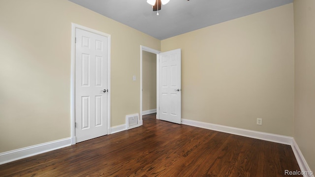 1139 S 7th St, Ann Arbor, MI 48103 - unfurnished bedroom featuring dark wood finished floors and a ceiling fan