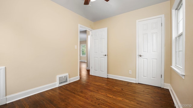 1139 S 7th St, Ann Arbor, MI 48103 - unfurnished bedroom featuring dark wood-type flooring and a ceiling fan