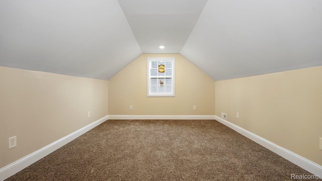 1139 S 7th St, Ann Arbor, MI 48103 - additional living space featuring dark carpet and vaulted ceiling
