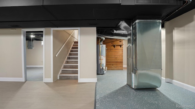 1139 S 7th St, Ann Arbor, MI 48103 - finished basement with gas water heater, stairs, electric panel, and heating unit