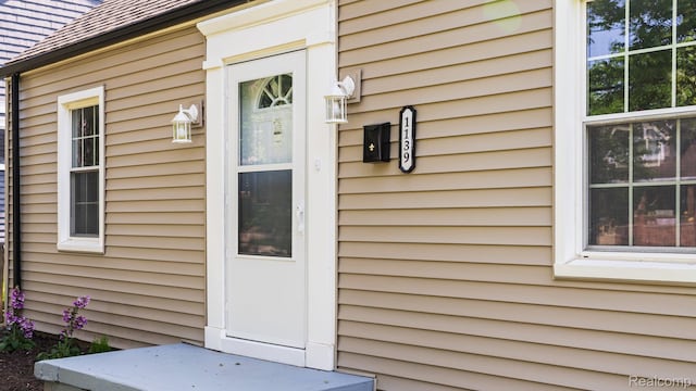 1139 S 7th St, Ann Arbor, MI 48103 - property entrance with a shingled roof