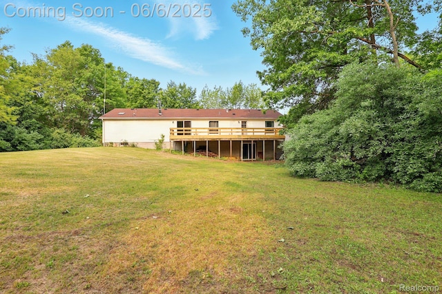10900 Tuttlehill Rd, Milan, MI 48160 - back of property featuring a deck and a yard