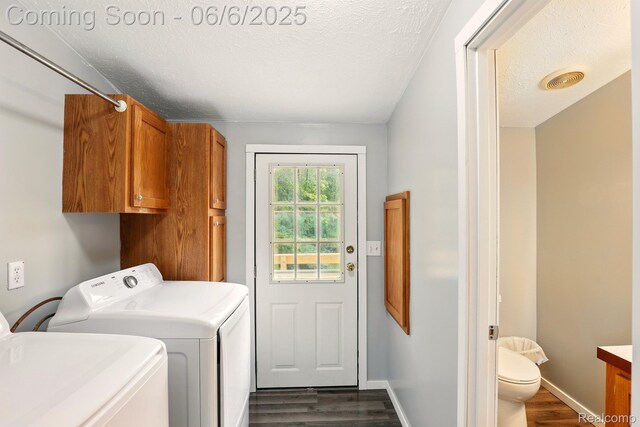 10900 Tuttlehill Rd, Milan, MI 48160 - laundry room featuring washer and dryer, dark wood-type flooring, baseboards, and a textured ceiling