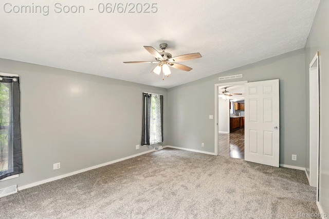 10900 Tuttlehill Rd, Milan, MI 48160 - unfurnished bedroom with carpet, lofted ceiling, baseboards, and a ceiling fan