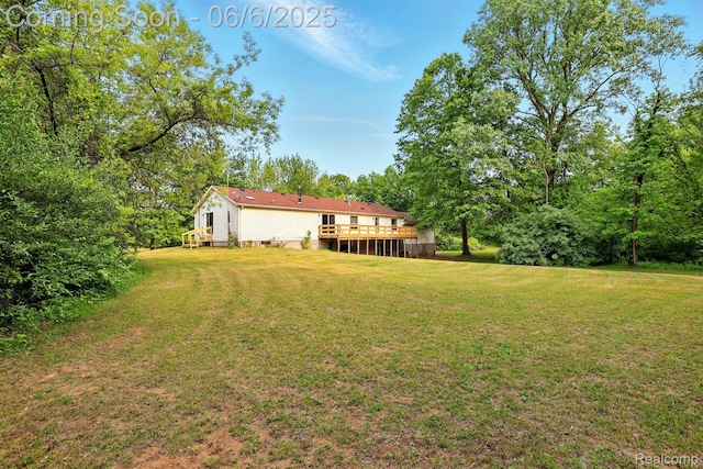 10900 Tuttlehill Rd, Milan, MI 48160 - view of green lawn with a deck