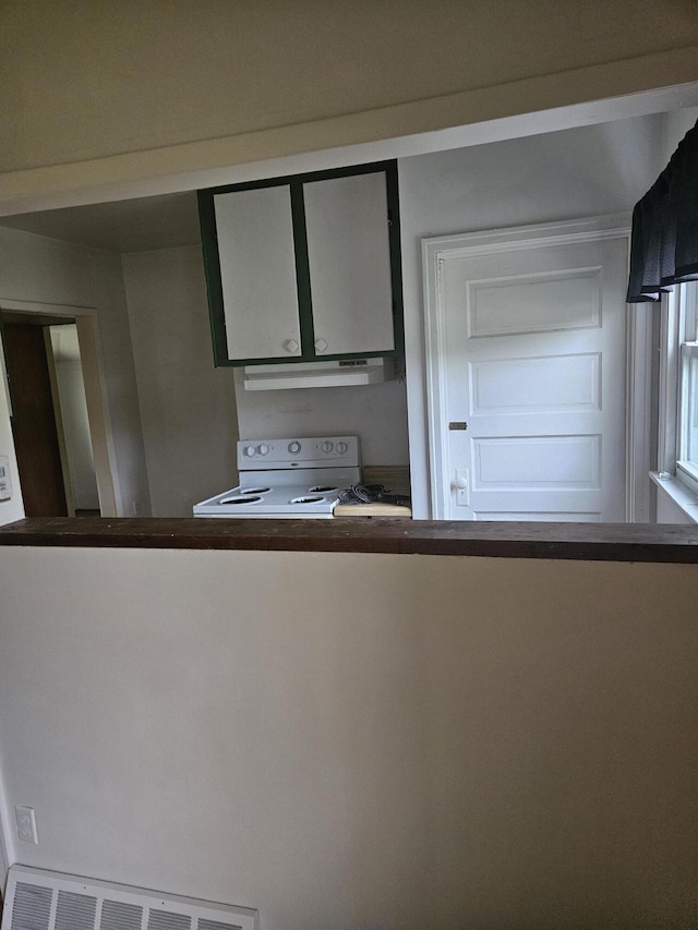 2745 Riverside Rd, Benton Harbor, MI 49022 - kitchen with white range with electric cooktop and extractor fan