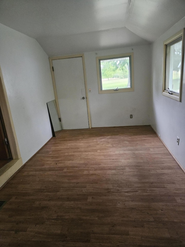 2745 Riverside Rd, Benton Harbor, MI 49022 - spare room with vaulted ceiling and wood finished floors