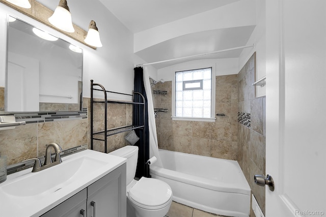 15487 Greydale St, Detroit, MI 48223 - bathroom featuring toilet, tile walls, vanity, shower / bathtub combination with curtain, and a wainscoted wall
