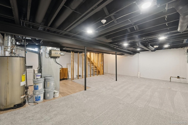 1011 Knowles St, Royal Oak, MI 48067 - finished basement featuring gas water heater, stairway, and carpet floors
