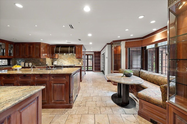 490 E Long Lake Rd, Bloomfield Hills, MI 48304 - kitchen with stone tile flooring, ornamental molding, ventilation hood, tasteful backsplash, and recessed lighting