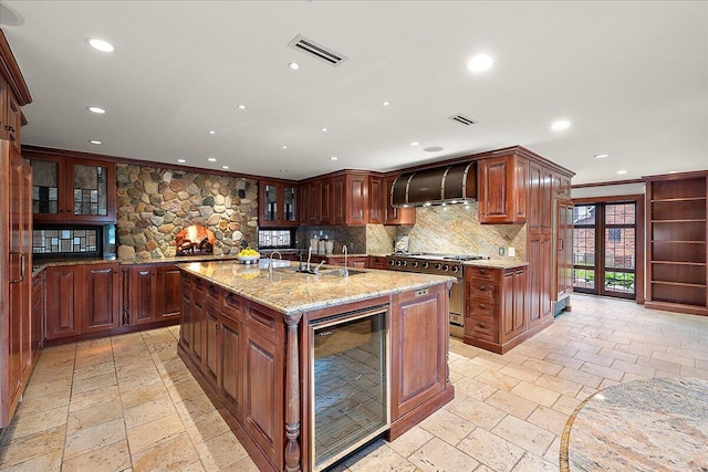 490 E Long Lake Rd, Bloomfield Hills, MI 48304 - kitchen featuring wine cooler, stainless steel range, extractor fan, decorative backsplash, and recessed lighting