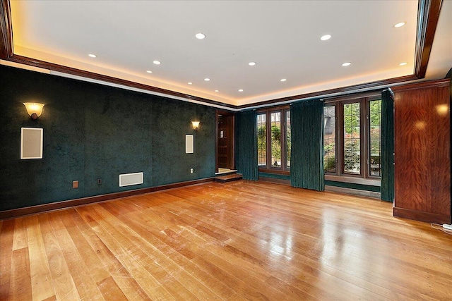 490 E Long Lake Rd, Bloomfield Hills, MI 48304 - empty room with a tray ceiling, light wood-style flooring, and recessed lighting
