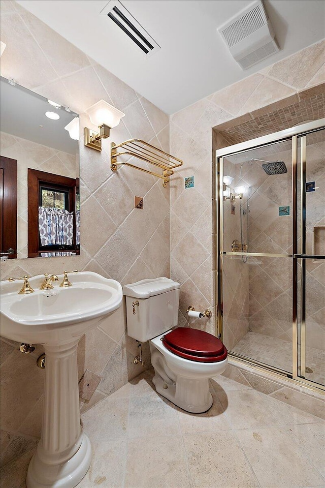 490 E Long Lake Rd, Bloomfield Hills, MI 48304 - bathroom with tile walls, toilet, a stall shower, a sink, and tile patterned floors