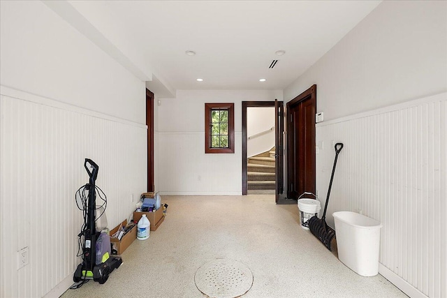 490 E Long Lake Rd, Bloomfield Hills, MI 48304 - below grade area featuring a wainscoted wall and stairs