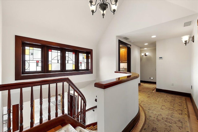 490 E Long Lake Rd, Bloomfield Hills, MI 48304 - hall featuring high vaulted ceiling, a chandelier, baseboards, an upstairs landing, and wood finished floors