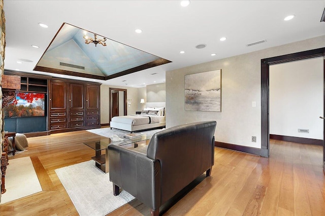 490 E Long Lake Rd, Bloomfield Hills, MI 48304 - living room with light wood-style floors, baseboards, recessed lighting, a chandelier, and a tray ceiling