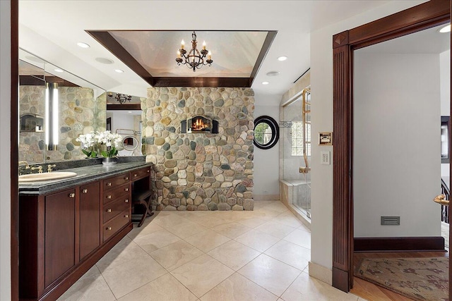 490 E Long Lake Rd, Bloomfield Hills, MI 48304 - bathroom featuring vanity, a chandelier, and tile patterned flooring
