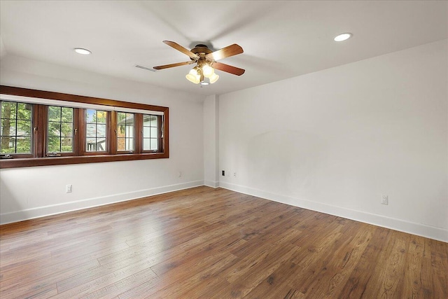 490 E Long Lake Rd, Bloomfield Hills, MI 48304 - spare room with a ceiling fan, baseboards, wood finished floors, and recessed lighting