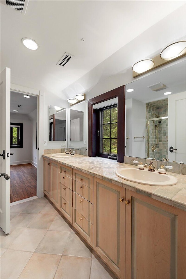 490 E Long Lake Rd, Bloomfield Hills, MI 48304 - bathroom with a shower stall, double vanity, tile patterned floors, and recessed lighting