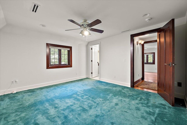 490 E Long Lake Rd, Bloomfield Hills, MI 48304 - unfurnished bedroom with carpet, baseboards, and ceiling fan