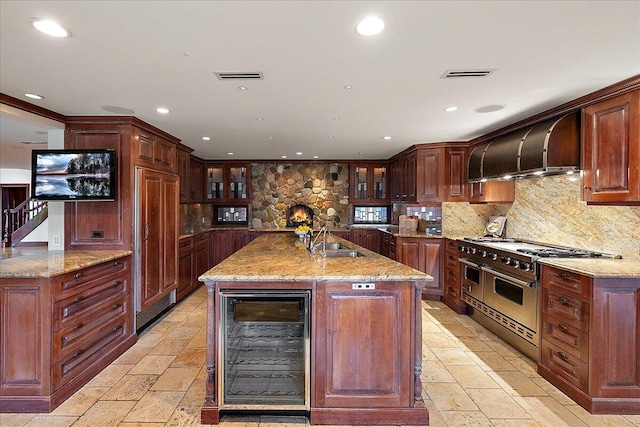 490 E Long Lake Rd, Bloomfield Hills, MI 48304 - kitchen featuring wine cooler, range with two ovens, stone tile flooring, recessed lighting, and a sink