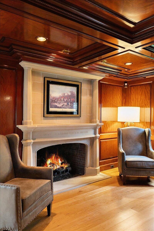 490 E Long Lake Rd, Bloomfield Hills, MI 48304 - sitting room featuring ornamental molding, a warm lit fireplace, wood finished floors, and coffered ceiling