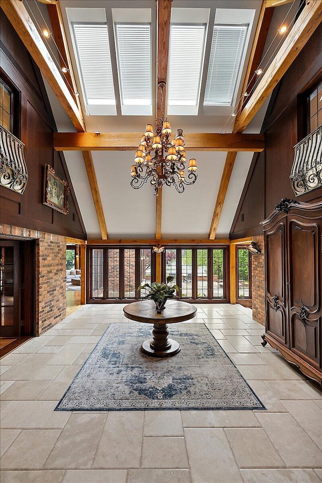 490 E Long Lake Rd, Bloomfield Hills, MI 48304 - entryway with beam ceiling, a chandelier, high vaulted ceiling, stone tile flooring, and wood walls