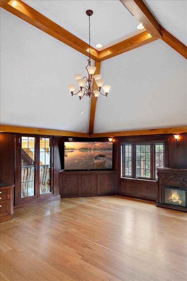 490 E Long Lake Rd, Bloomfield Hills, MI 48304 - unfurnished living room with high vaulted ceiling, beamed ceiling, a chandelier, a glass covered fireplace, and wood finished floors