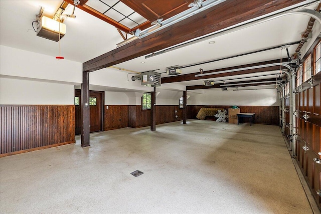 490 E Long Lake Rd, Bloomfield Hills, MI 48304 - garage featuring a wainscoted wall, wood walls, and a garage door opener