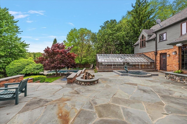 490 E Long Lake Rd, Bloomfield Hills, MI 48304 - view of patio / terrace featuring a fire pit and an in-ground hot tub
