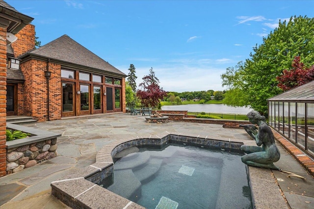490 E Long Lake Rd, Bloomfield Hills, MI 48304 - view of pool with an outdoor fire pit, a patio, and a water view