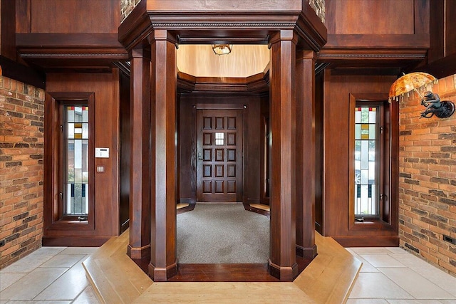 490 E Long Lake Rd, Bloomfield Hills, MI 48304 - foyer featuring brick wall, wood walls, and ornate columns