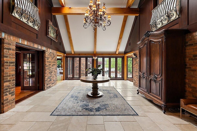 490 E Long Lake Rd, Bloomfield Hills, MI 48304 - foyer with high vaulted ceiling, beamed ceiling, a chandelier, and stone tile flooring