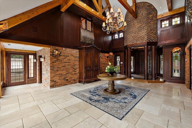 490 E Long Lake Rd, Bloomfield Hills, MI 48304 - foyer featuring high vaulted ceiling, beam ceiling, a chandelier, plenty of natural light, and stone tile floors
