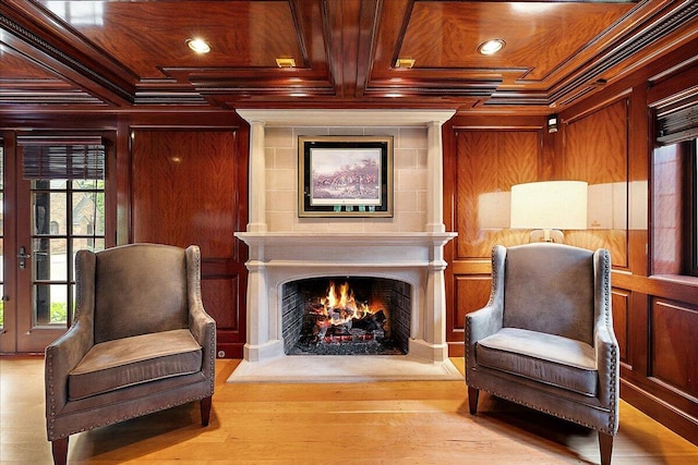 490 E Long Lake Rd, Bloomfield Hills, MI 48304 - living area with crown molding, a warm lit fireplace, wooden ceiling, wood finished floors, and wooden walls
