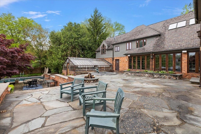 490 E Long Lake Rd, Bloomfield Hills, MI 48304 - view of patio featuring a fire pit