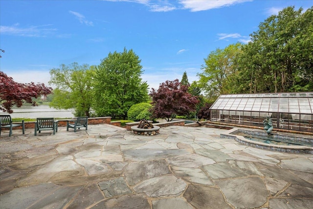 490 E Long Lake Rd, Bloomfield Hills, MI 48304 - view of patio featuring a fire pit and an outdoor hot tub