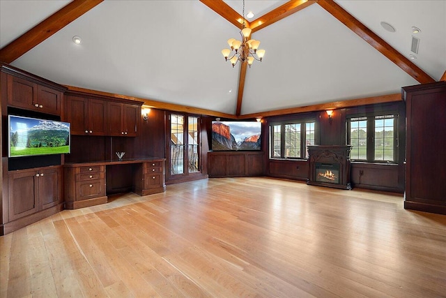 490 E Long Lake Rd, Bloomfield Hills, MI 48304 - unfurnished living room with beam ceiling, a chandelier, light wood finished floors, high vaulted ceiling, and a glass covered fireplace