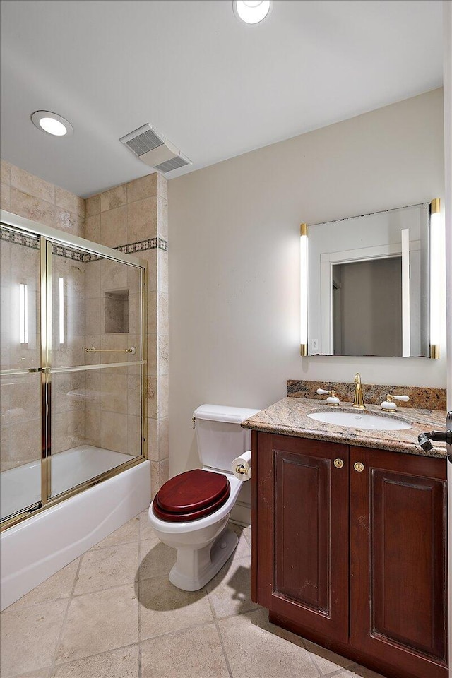 490 E Long Lake Rd, Bloomfield Hills, MI 48304 - bathroom featuring toilet, vanity, and combined bath / shower with glass door