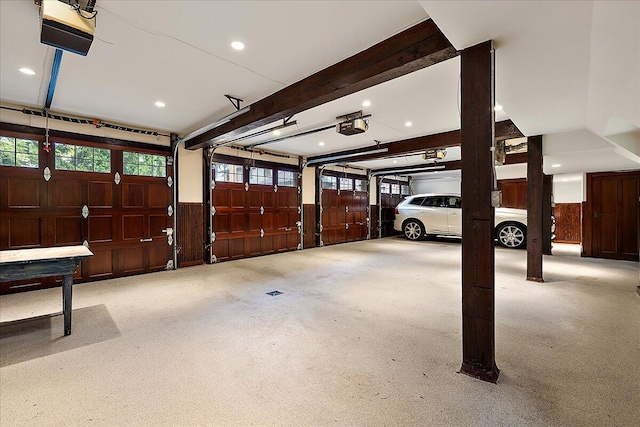 490 E Long Lake Rd, Bloomfield Hills, MI 48304 - garage with a garage door opener, wood walls, recessed lighting, and wainscoting