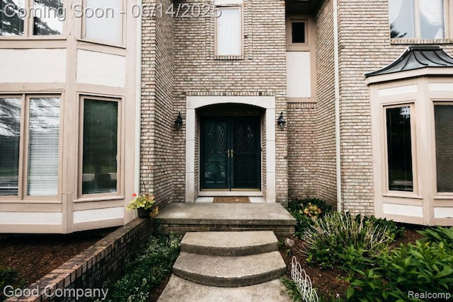 515 Oakbridge Dr, Rochester, MI 48306 - doorway to property with brick siding