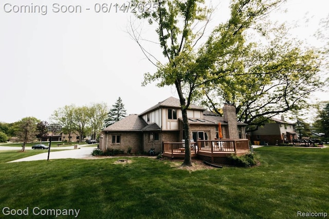 515 Oakbridge Dr, Rochester, MI 48306 - back of house featuring a wooden deck, brick siding, a yard, and a chimney