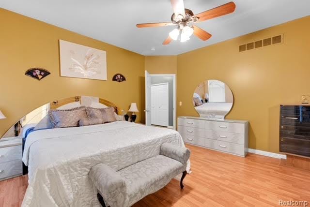 32051 W Cranston St, New Haven, MI 48048 - bedroom featuring wood finished floors, baseboards, and a ceiling fan