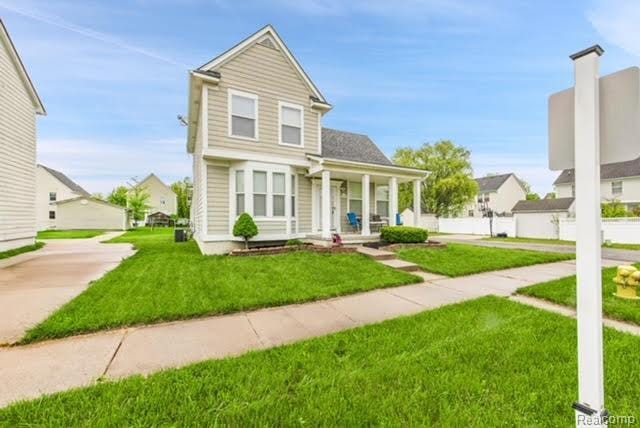 32051 W Cranston St, New Haven, MI 48048 - view of front facade featuring a porch and a front yard