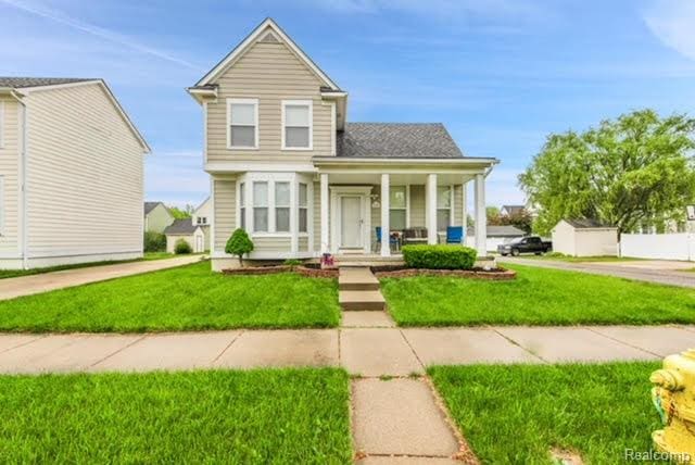 32051 W Cranston St, New Haven, MI 48048 - view of front of house with a porch and a front lawn